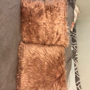 Pink fuzzy throw pillows